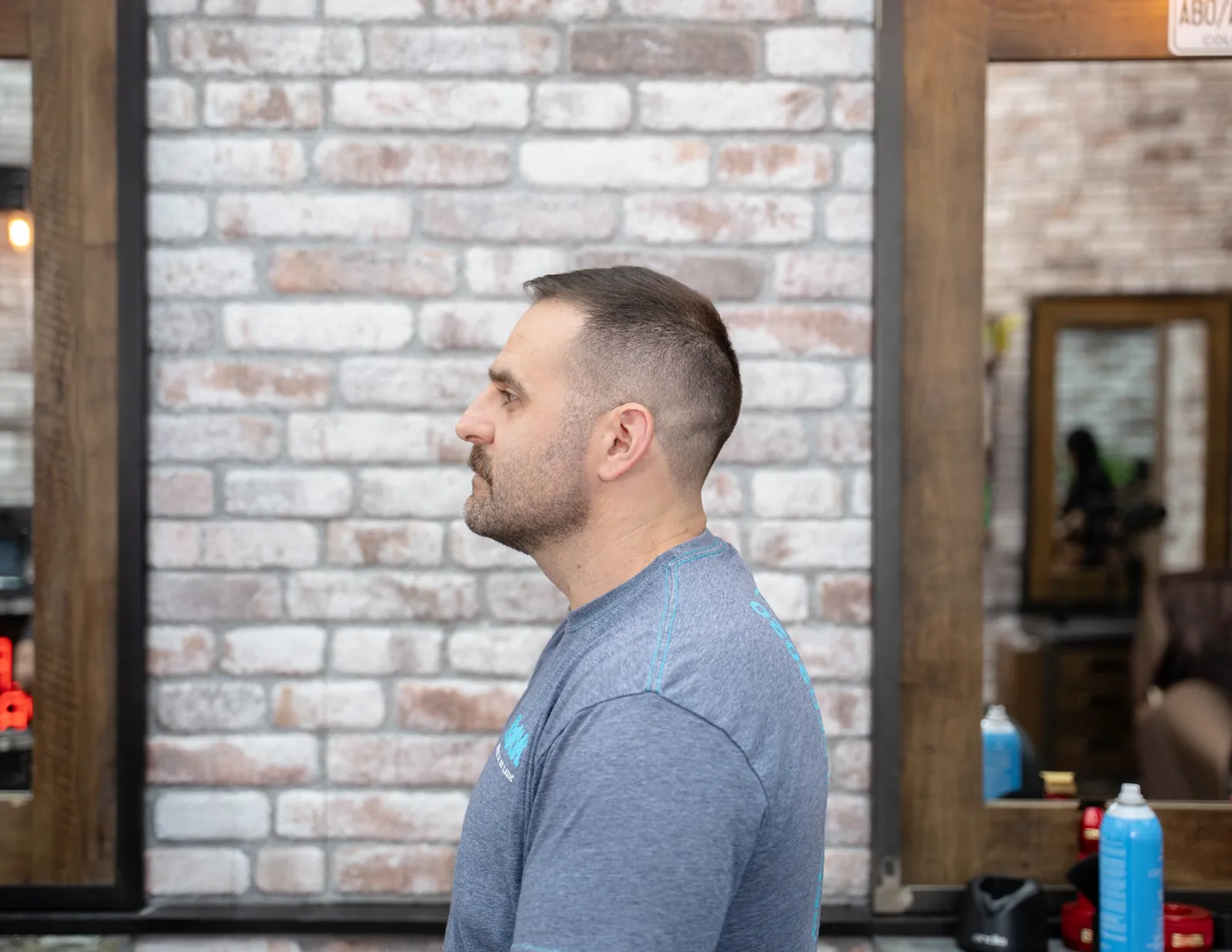 Profile of a clean skin fade haircut result on a Denver client at Alfani's Barbershop