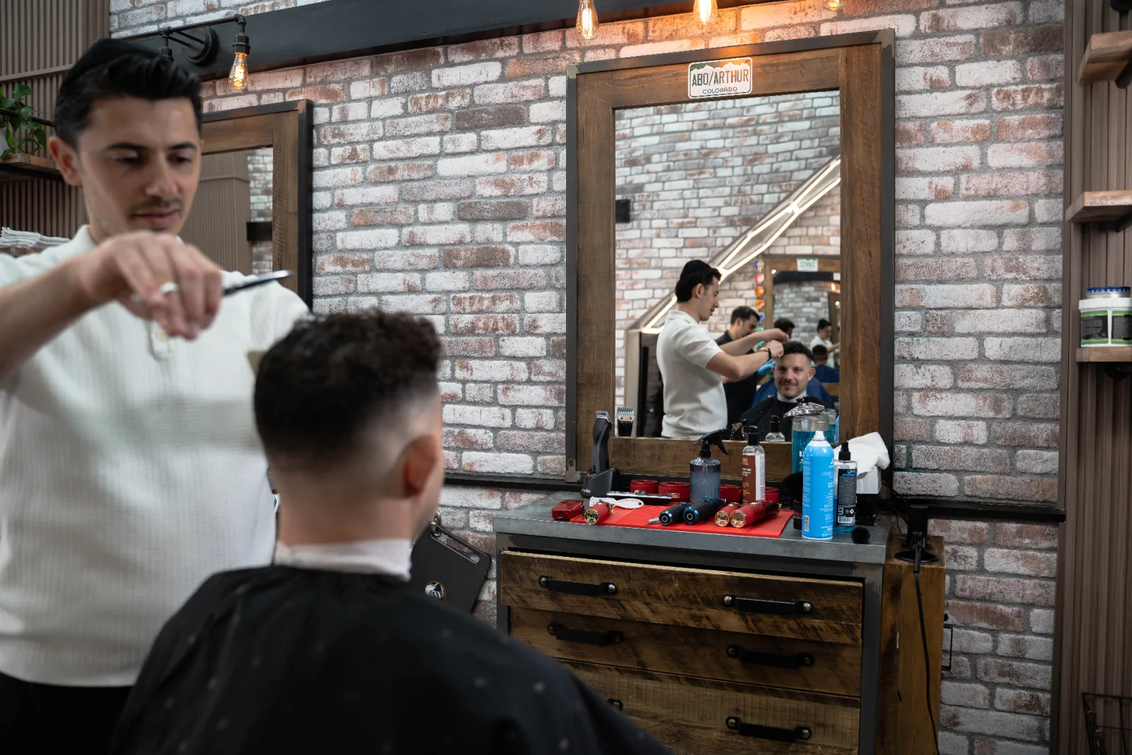 Scissor cut and precision styling at Alfani's Barbershop near Cheesman Park Denver