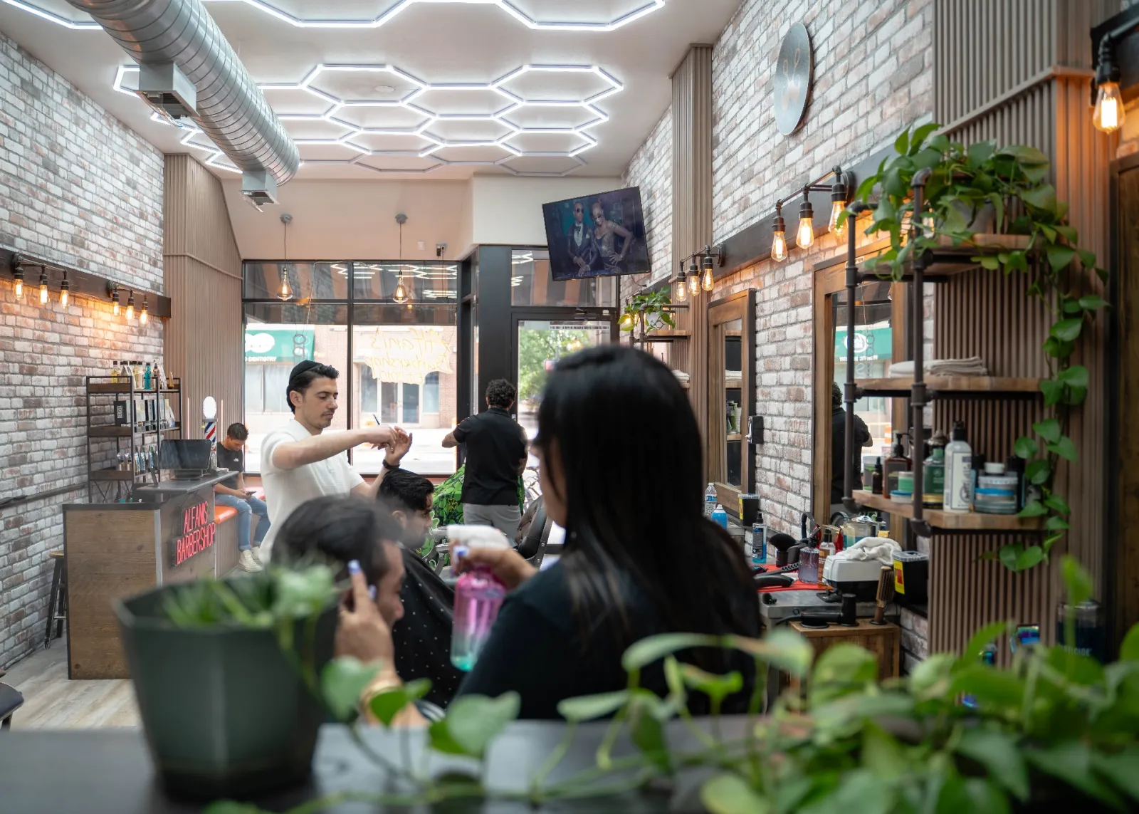 Inside Alfani's Barbershop Denver: hex lighting, brick walls, and live haircuts on East Colfax