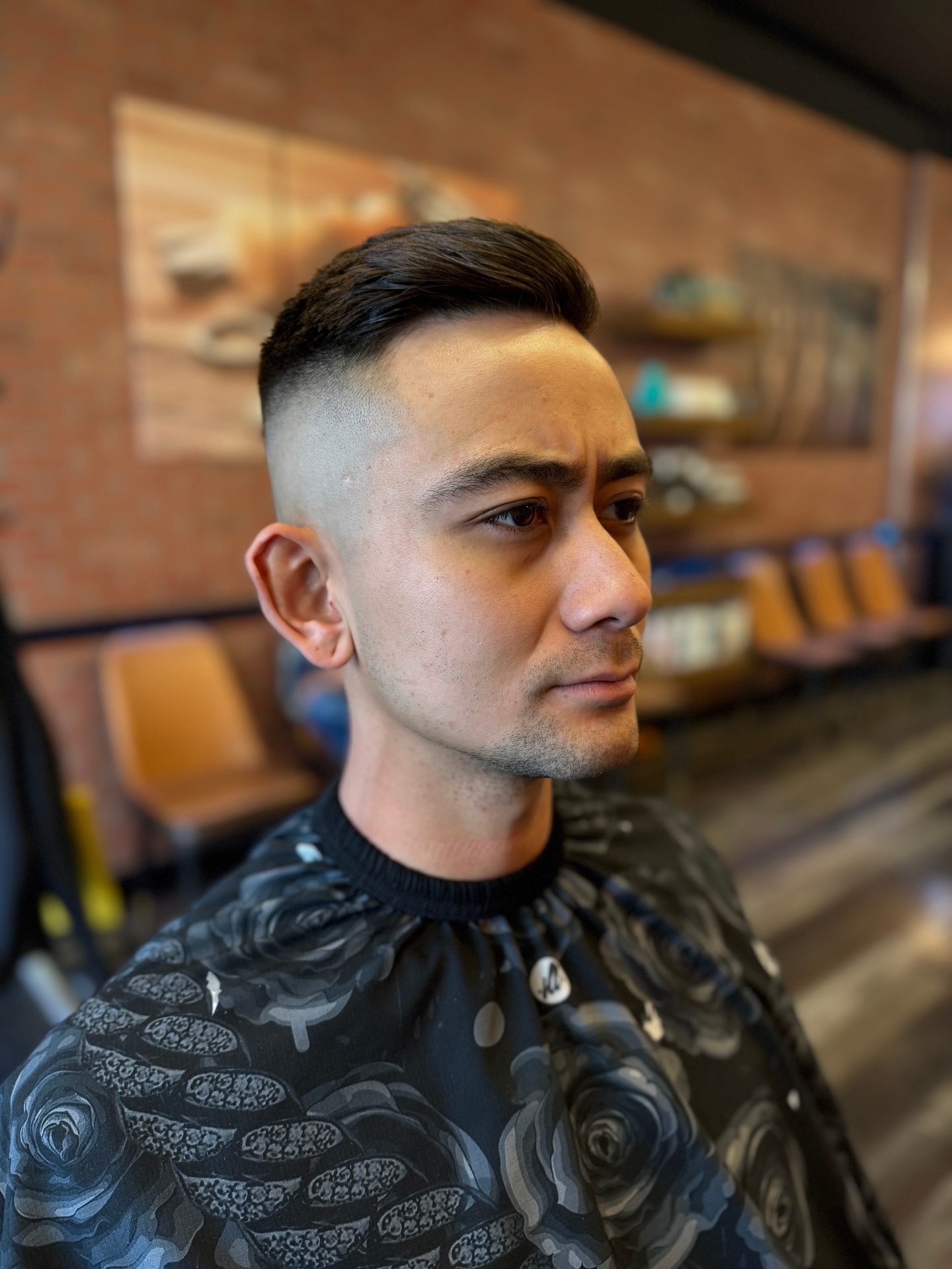 Expert barber service at Alfani's Denver